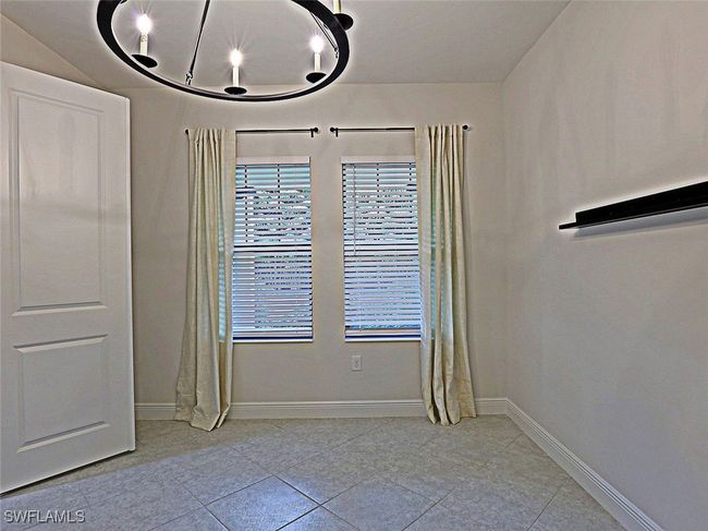 Unfurnished room featuring tile patterned floors, healthy amount of natural light, and baseboards | Image 25