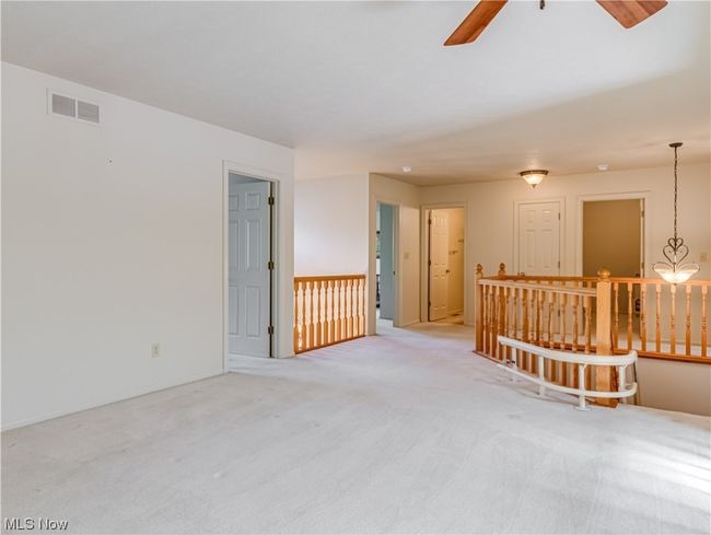 Carpeted spare room featuring ceiling fan | Image 23