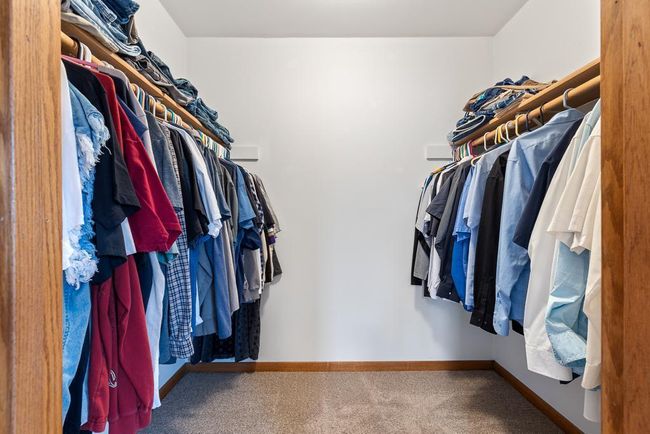 Upper level primary bedroom walk-in closet | Image 39