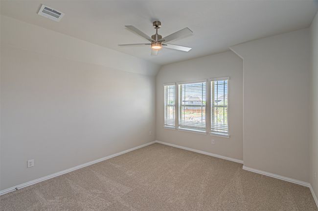Spare room with light colored carpet and ceiling fan | Image 35