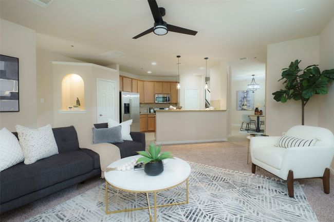 Living area with a ceiling fan, recessed lighting, and light colored carpet | Image 5