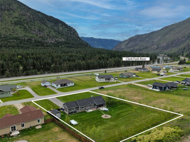 View of mountain backdrop with a heavily wooded area and nearby suburban area | Image 64