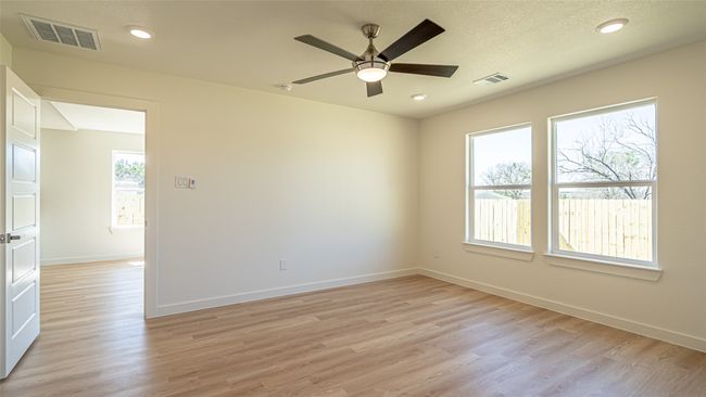 Primary bedroom off the dining area, overlooking the back yard | Image 18