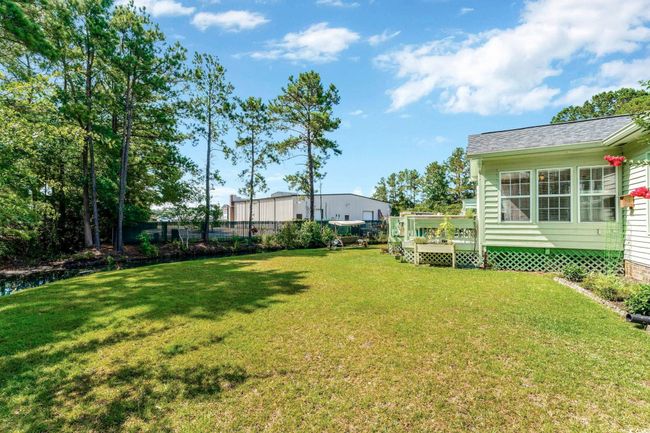View of yard with a wooden deck | Image 24