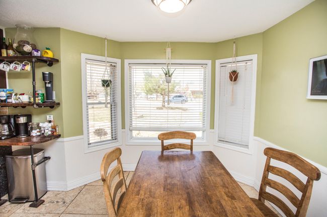 Three Beautiful windows in the kitchen eating area. | Image 19