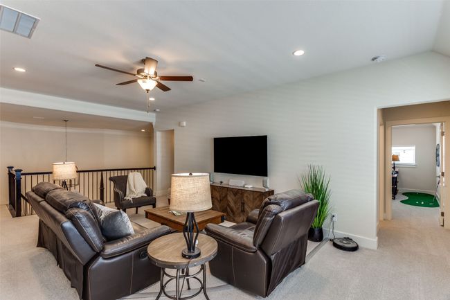 Living area with light carpet, ceiling fan, recessed lighting, and ornamental molding | Image 27