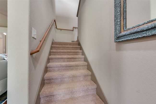 Stairway featuring a textured wall | Image 30