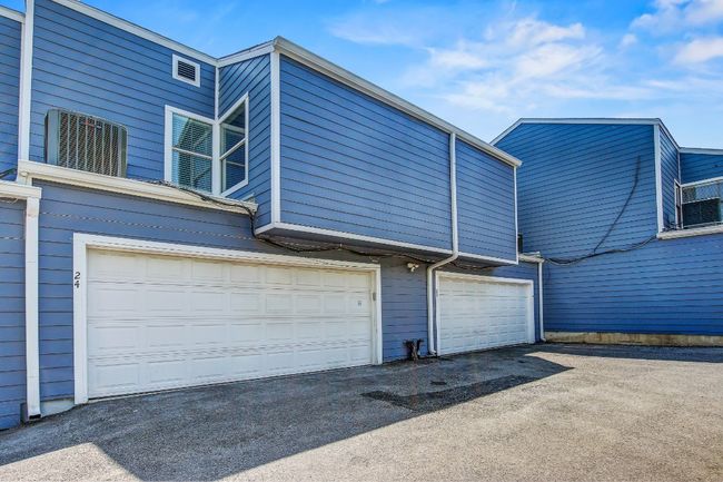 Garage featuring asphalt driveway | Image 26