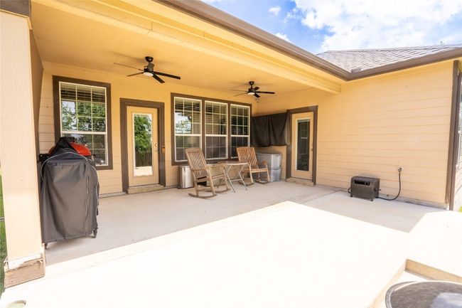 View of patio / terrace with a ceiling fan | Image 22