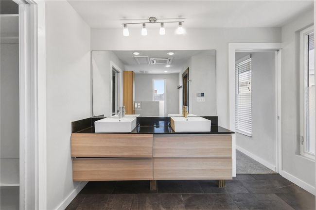 Bathroom featuring double vanity and tile patterned flooring | Image 17