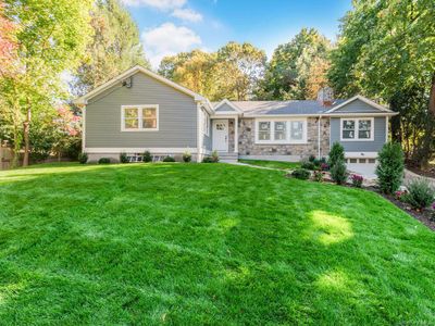 View of front of house featuring a front yard and a garage | Image 2