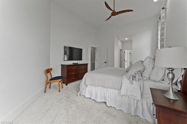Bedroom with carpet floors and ceiling fan | Image 23