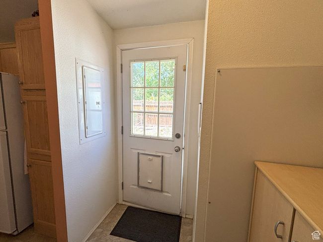 Entryway with electric panel and a textured wall | Image 46