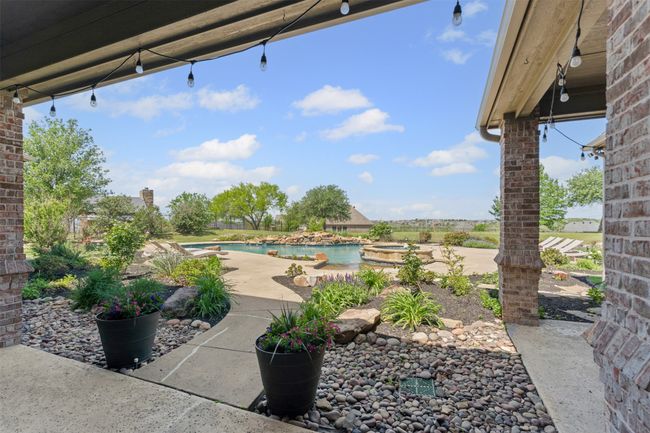 View of patio featuring an outdoor pool | Image 35