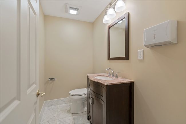 2nd floor men's half bath. Could be converted to a full bathroom. | Image 20