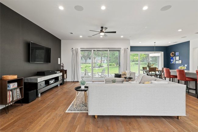 Living room featuring a ceiling fan, recessed lighting, and wood finished floors | Image 8