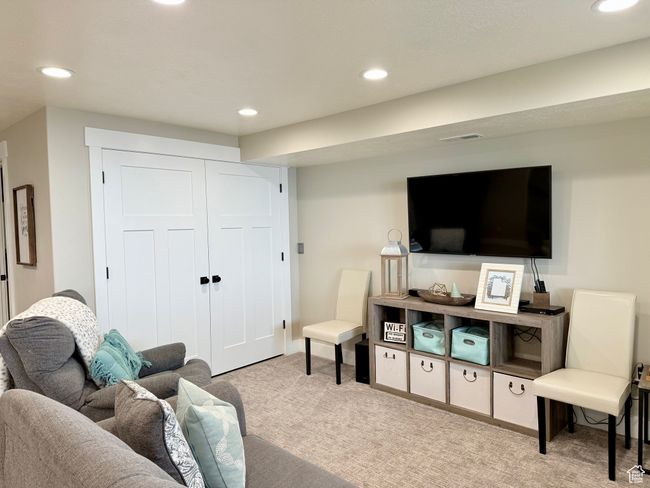 Carpeted living area featuring recessed lighting | Image 39