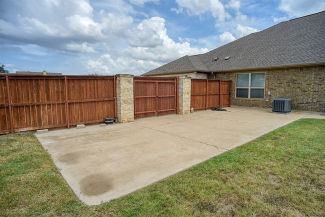 Extra concrete pad behind double gate suitable for storing a boat or trailer | Image 29