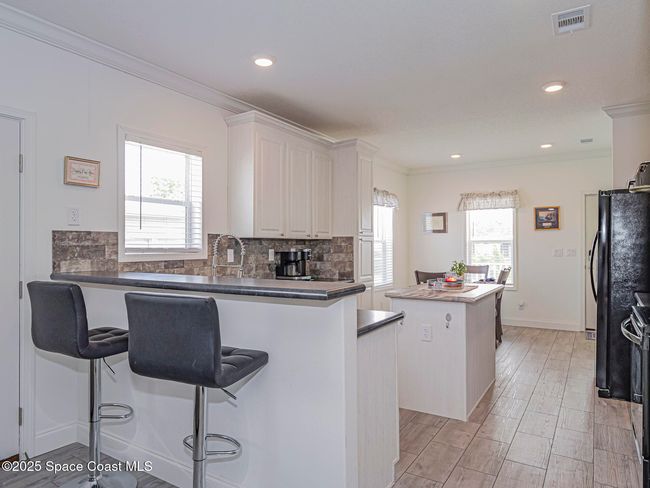623 Hyacinth Cir, House other with 3 bedrooms, 2 bathrooms and null parking in Barefoot Bay FL | Image 16