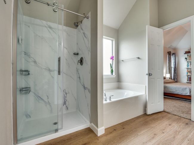 Primary bathroom with separate shower and garden tub | Image 14