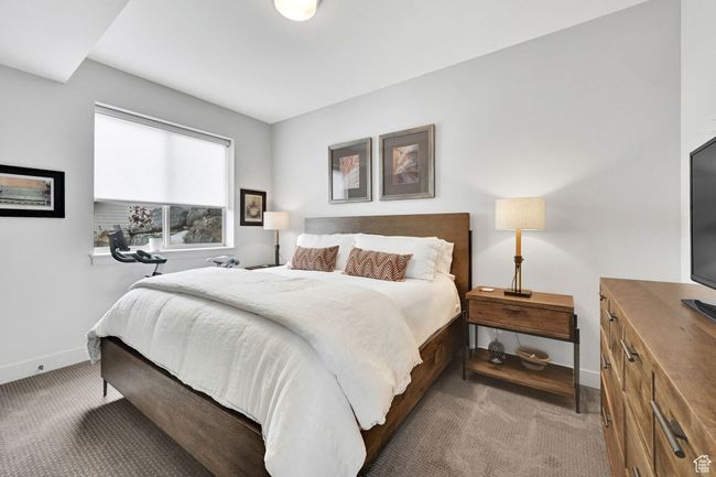 Carpeted bedroom featuring baseboards | Image 46