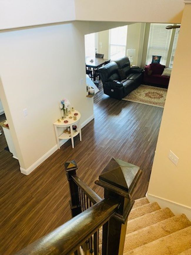 Stairs with wood finished floors and baseboards | Image 7