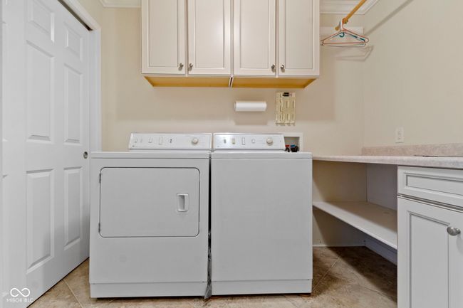 Main Floor Laundry with Shelving, Utility Sink and Clothes hanging area! | Image 26