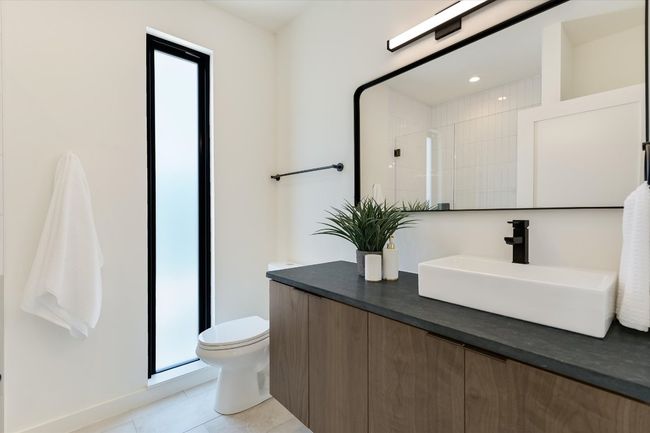 Full bath with vanity, a shower stall, tile patterned floors, and recessed lighting | Image 22