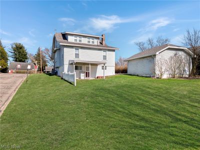 Rear view of house featuring a lawn | Image 2