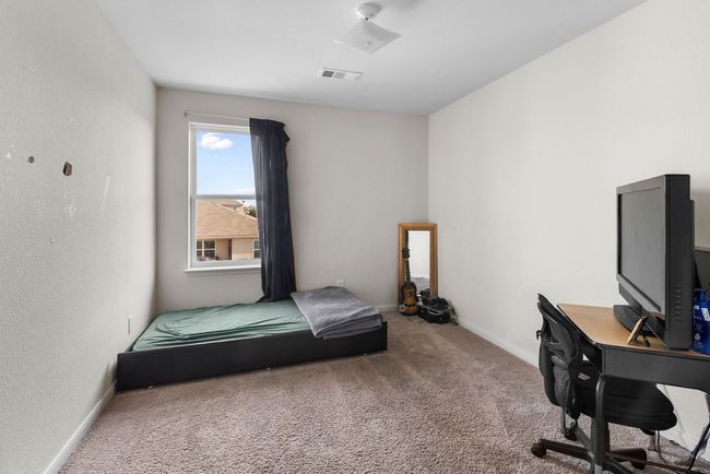 Bedroom featuring baseboards, visible vents, and carpet | Image 24