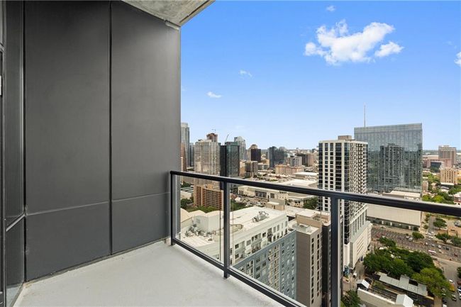 Balcony featuring a city view | Image 25