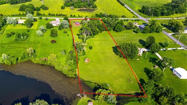 Overview of rural landscape with property parcel outlined and a nearby body of water | Image 32