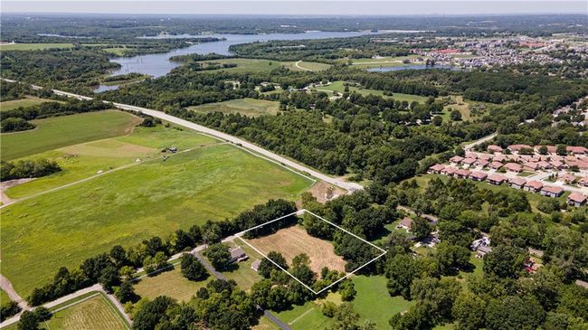 Aerial overview of property's location with a large body of water and property boundaries highlighted | Image 8