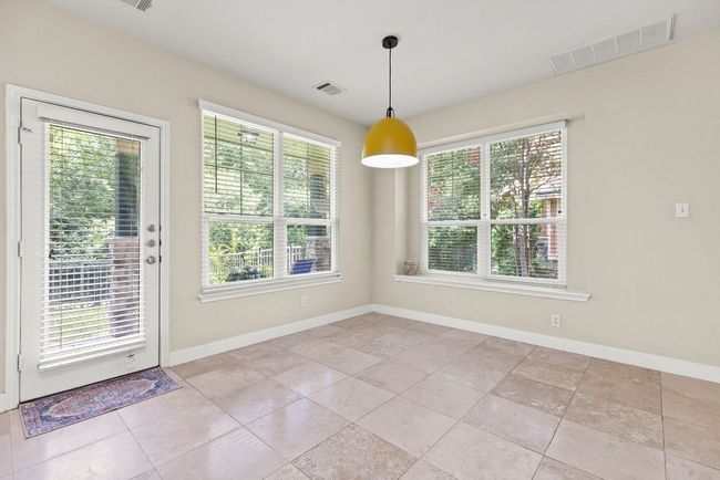 Dining Area view from Kitchen - see that patio door? Covered Patio & Greenbelt are just beyond!! | Image 13