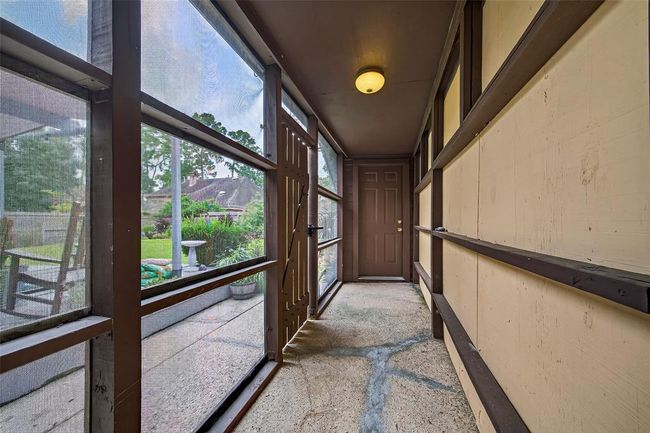 A softly lit hallway with backyard views offers a moment of calm between spaces—highlighting the home’s seamless flow and inviting glow. | Image 42