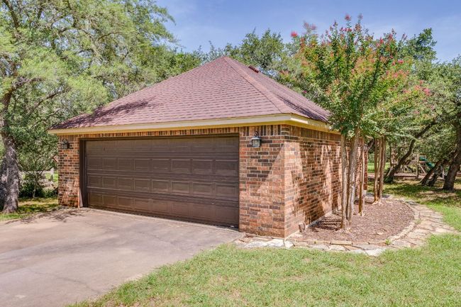Additional parking or flex space in this detached two car garage. | Image 32