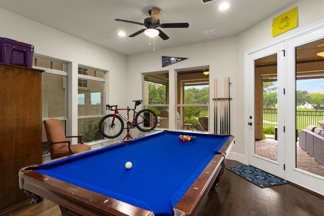 Game room with view to patio and golf course. | Image 32