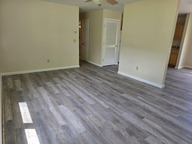 Spare room featuring wood finished floors and a ceiling fan | Image 14