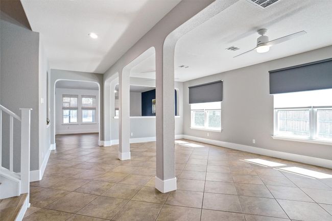 Open floor plan with formal dining and flex space down stairs. | Image 9