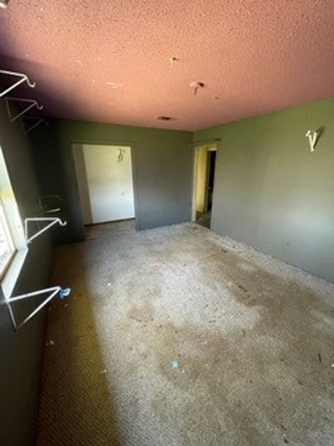 Unfurnished room featuring a textured ceiling | Image 28