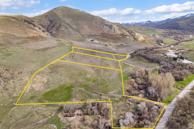Aerial view of property's location featuring a mountainous background and property boundaries highlighted | Image 15
