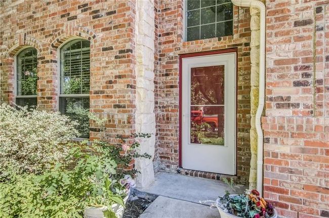 Property entrance with brick siding | Image 4