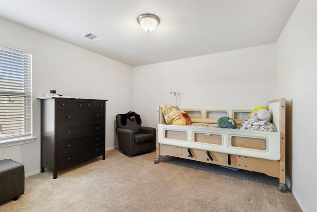 The third secondary bedroom upstairs also features a large closet for ample storage. | Image 37