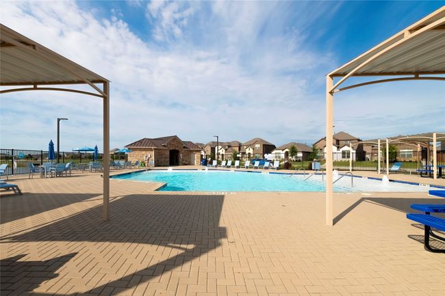 Community pool featuring a residential view and a patio | Image 38