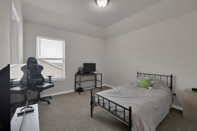 Carpeted bedroom featuring baseboards | Image 32