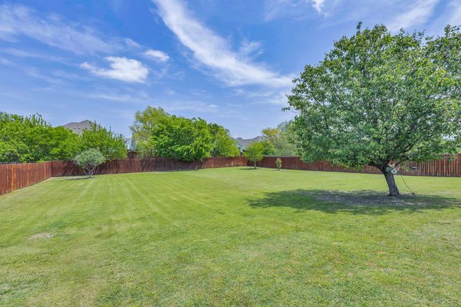 View of yard with a fenced backyard | Image 37