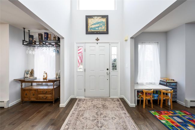 Dining area with dark wood-type flooring | Image 11