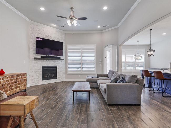 Family room open to kitchen with a view of the backyard | Image 7