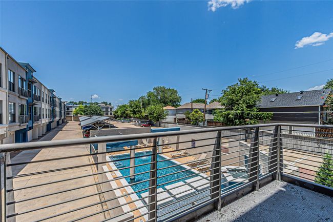 Community pool with a residential view | Image 26