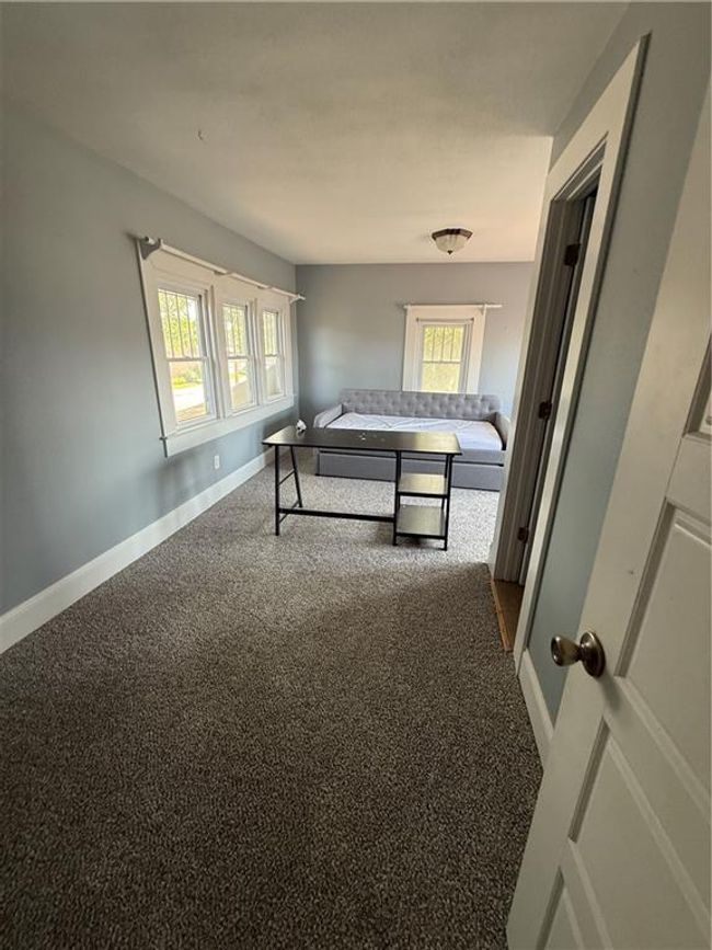 Bedroom with carpet floors and baseboards | Image 17